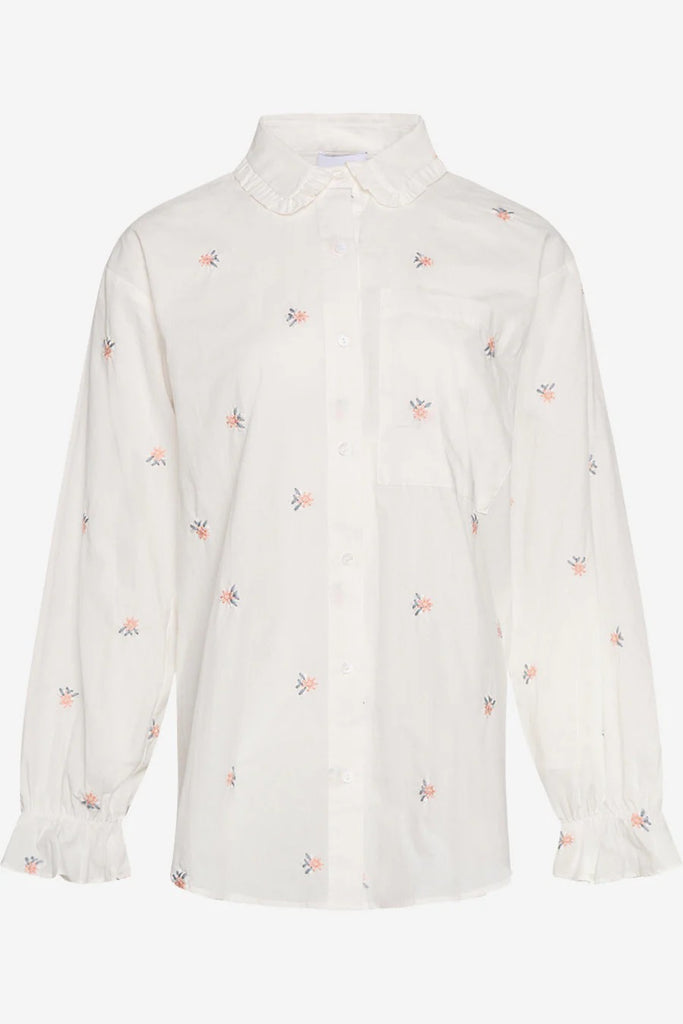 Romantisk skjorte med rysjedetaljer og broderte blomster